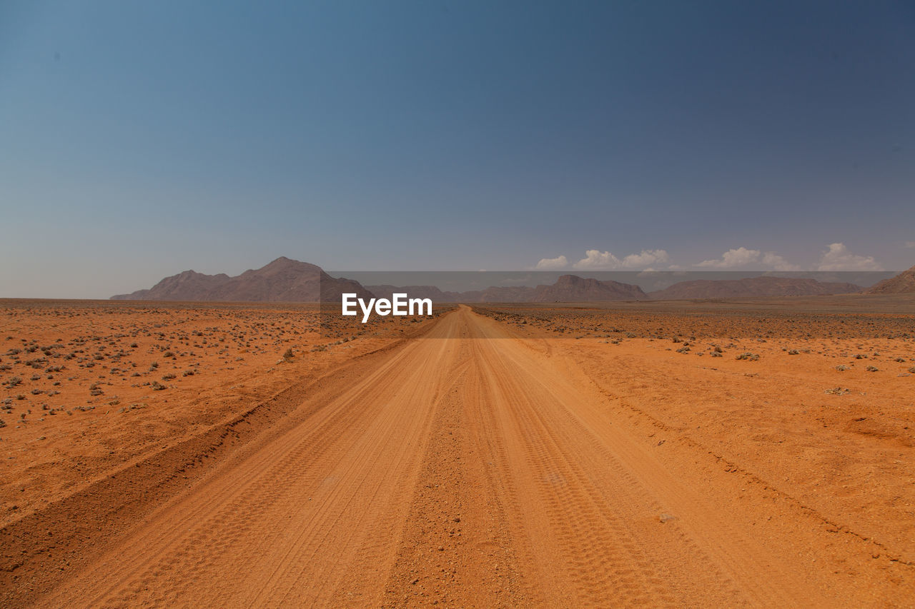 Scenic view of desert against clear sky