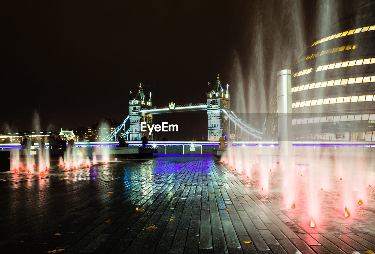 ILLUMINATED BRIDGE AT NIGHT