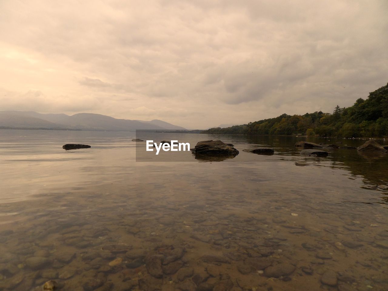 VIEW OF SEA AGAINST CLOUDY SKY