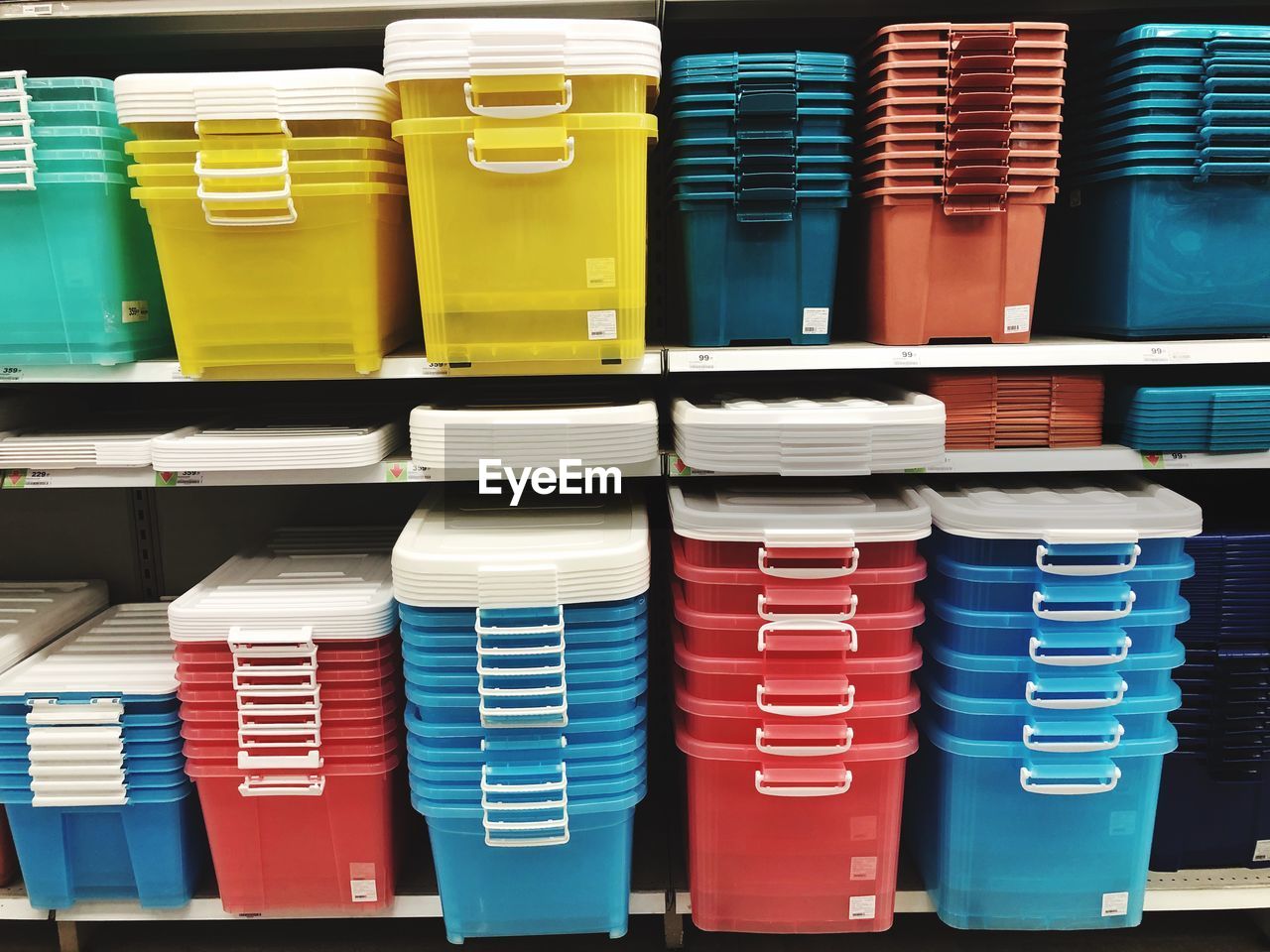 Full frame shot of colorful baskets arranged on shelf for sale in store