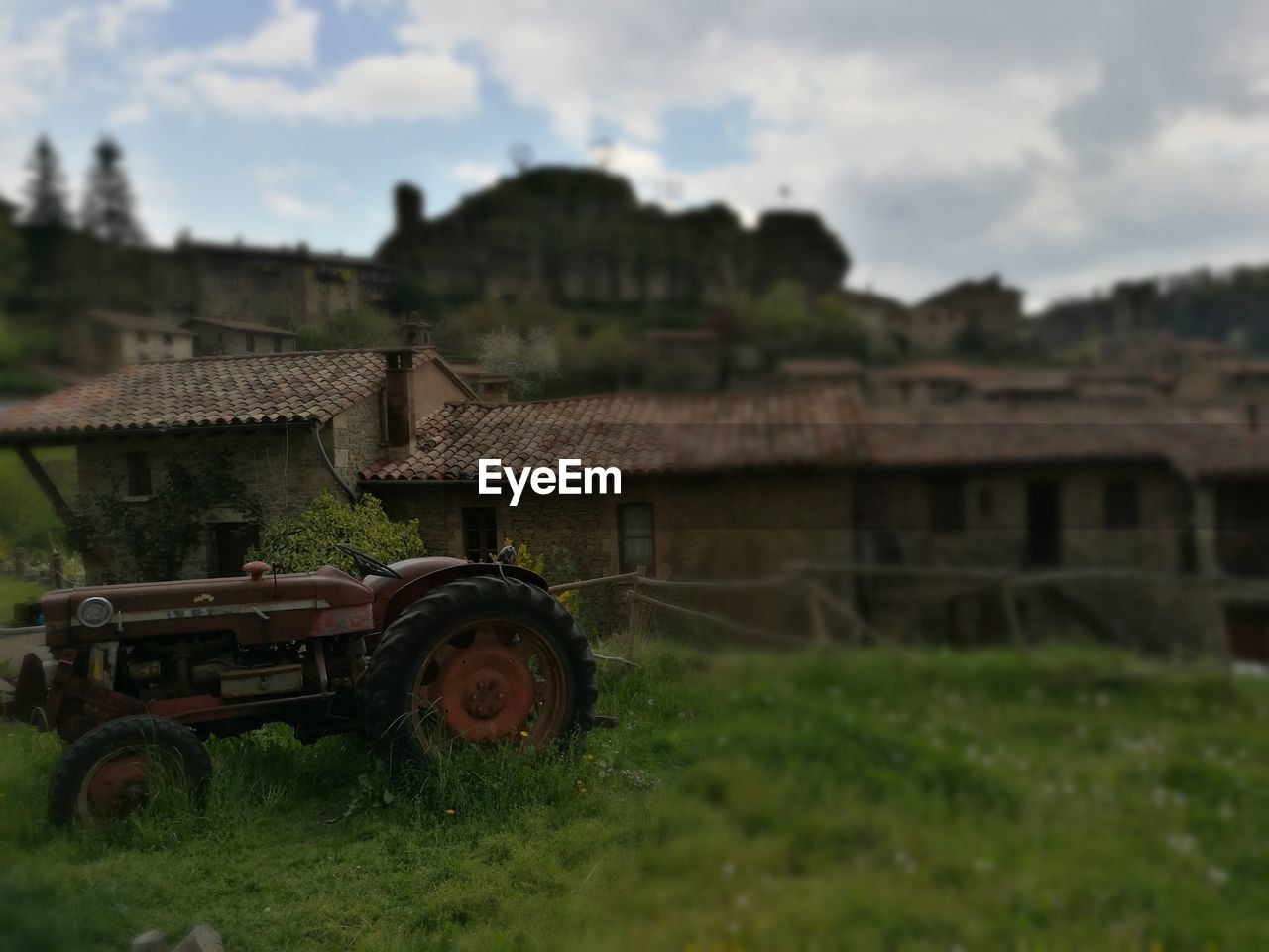 CLOSE-UP OF TRACTOR ON FIELD