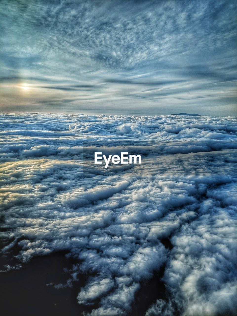 AERIAL VIEW OF CLOUDS OVER LANDSCAPE