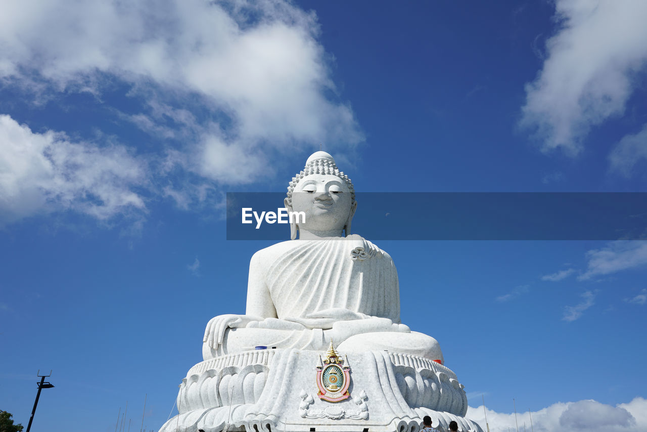 Low angle view of statue against sky