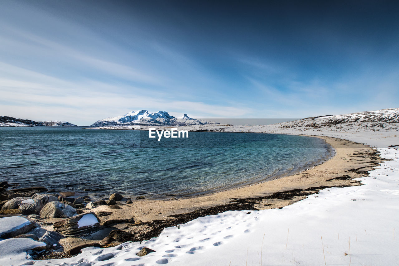 Scenic view of sea against sky during winter