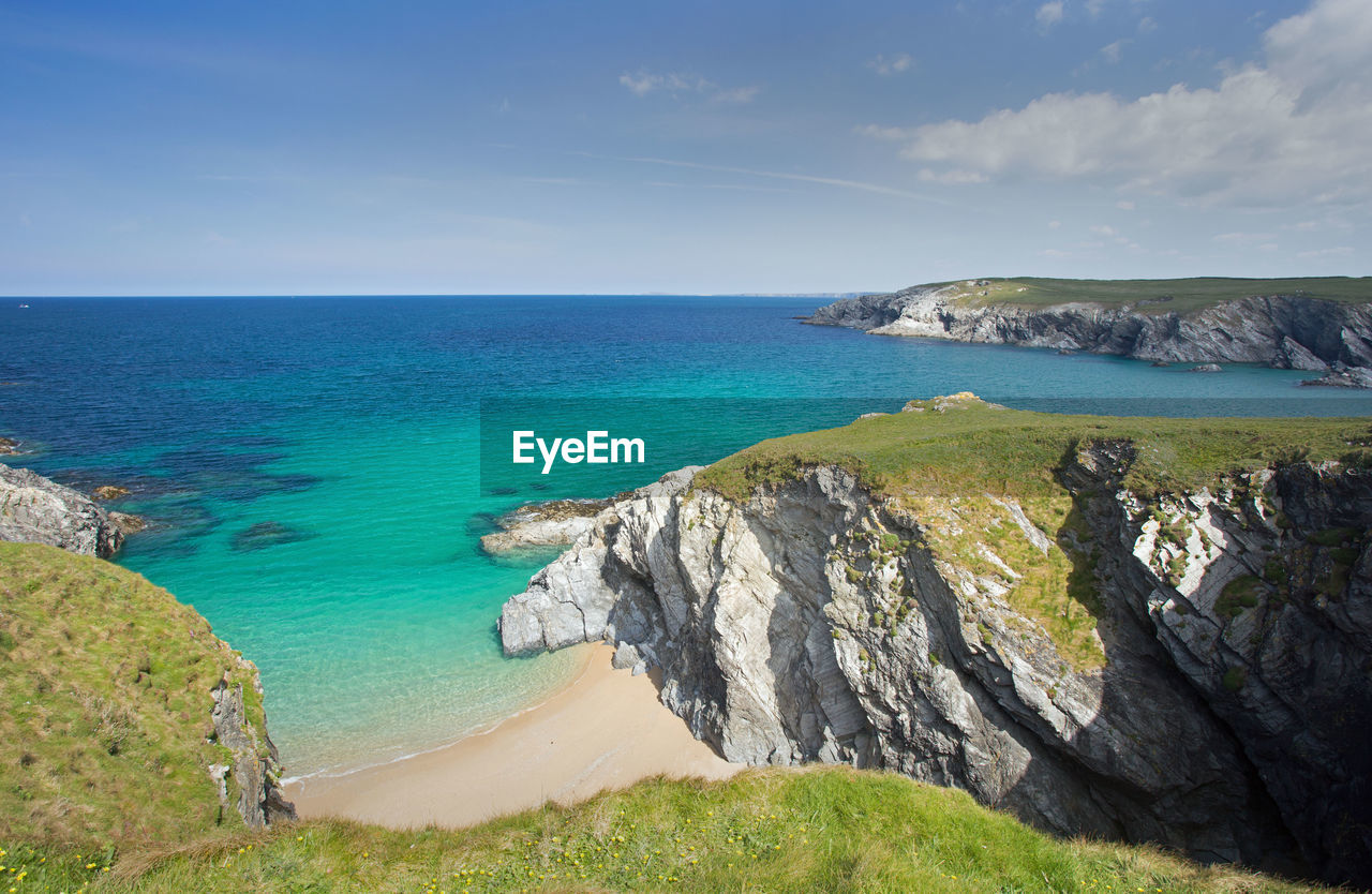 Scenic view of sea against blue sky