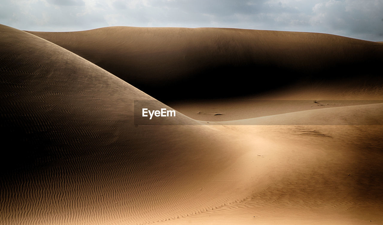 Scenic view of desert against sky