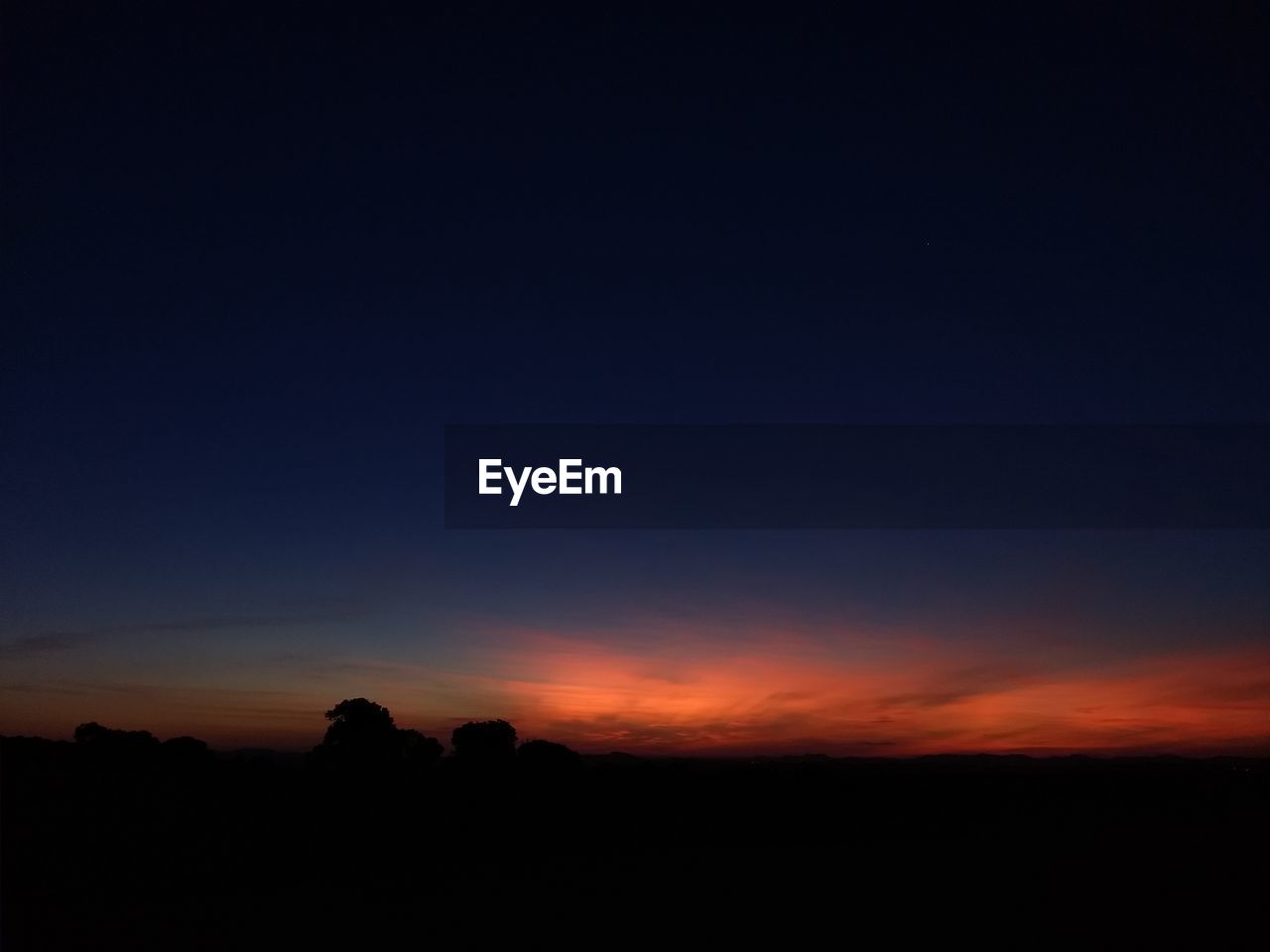 SILHOUETTE LANDSCAPE AGAINST SKY DURING SUNSET