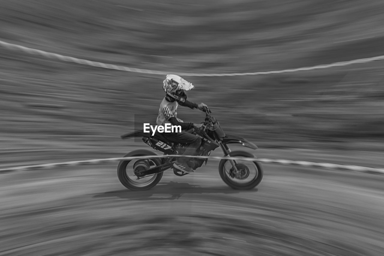 Man riding bicycle on road