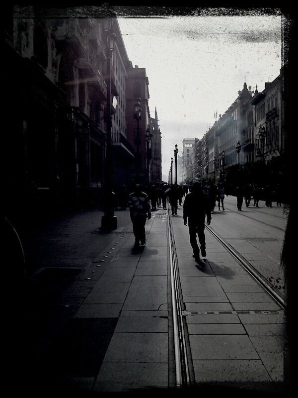 PEOPLE WALKING ON CITY STREET