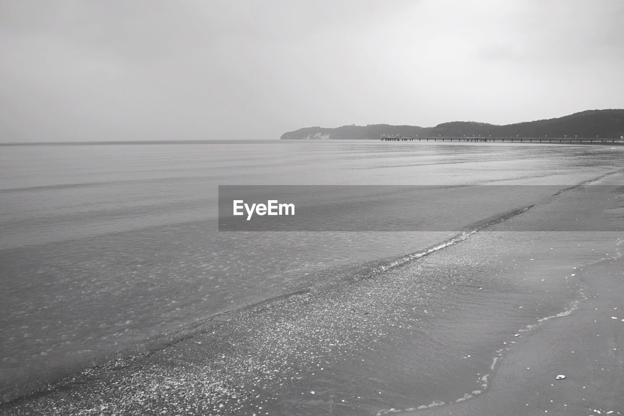 Scenic view of beach against clear sky