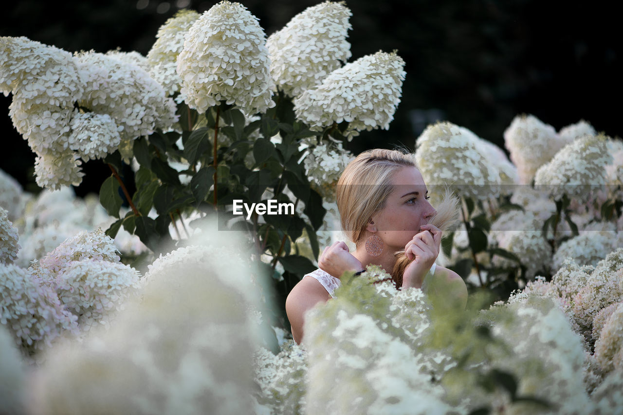 Full length of woman with flowers