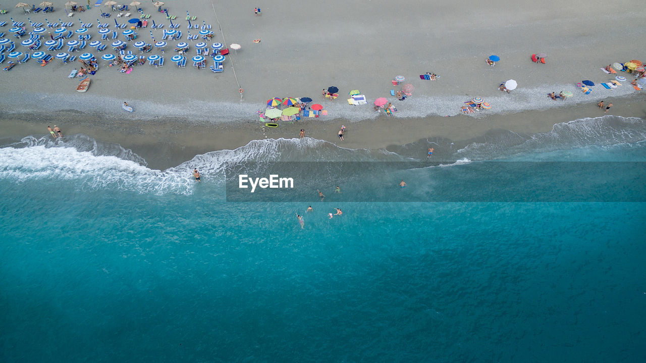 High angle view of people enjoying at beach