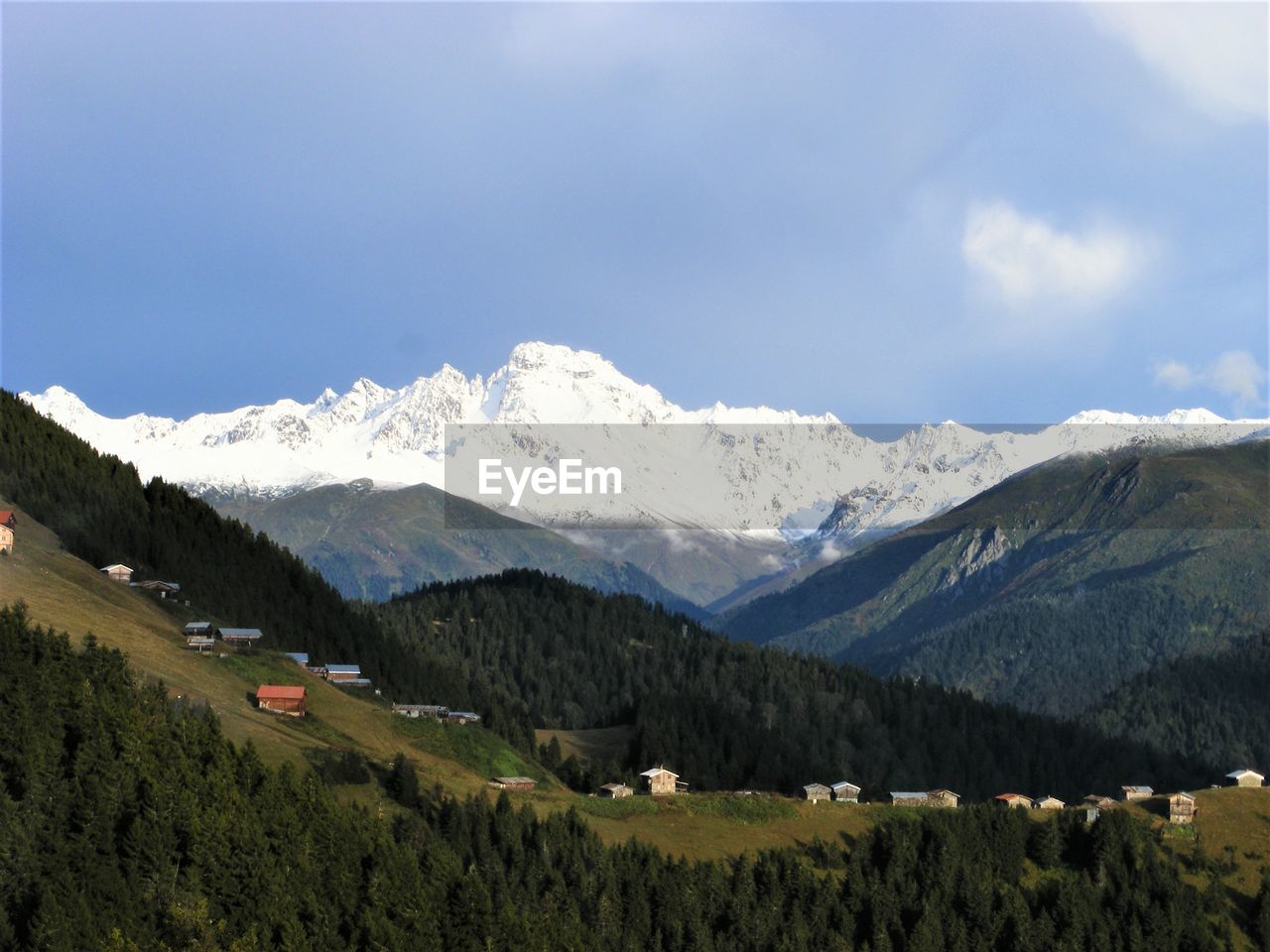 Scenic view of snowcapped mountains against sky