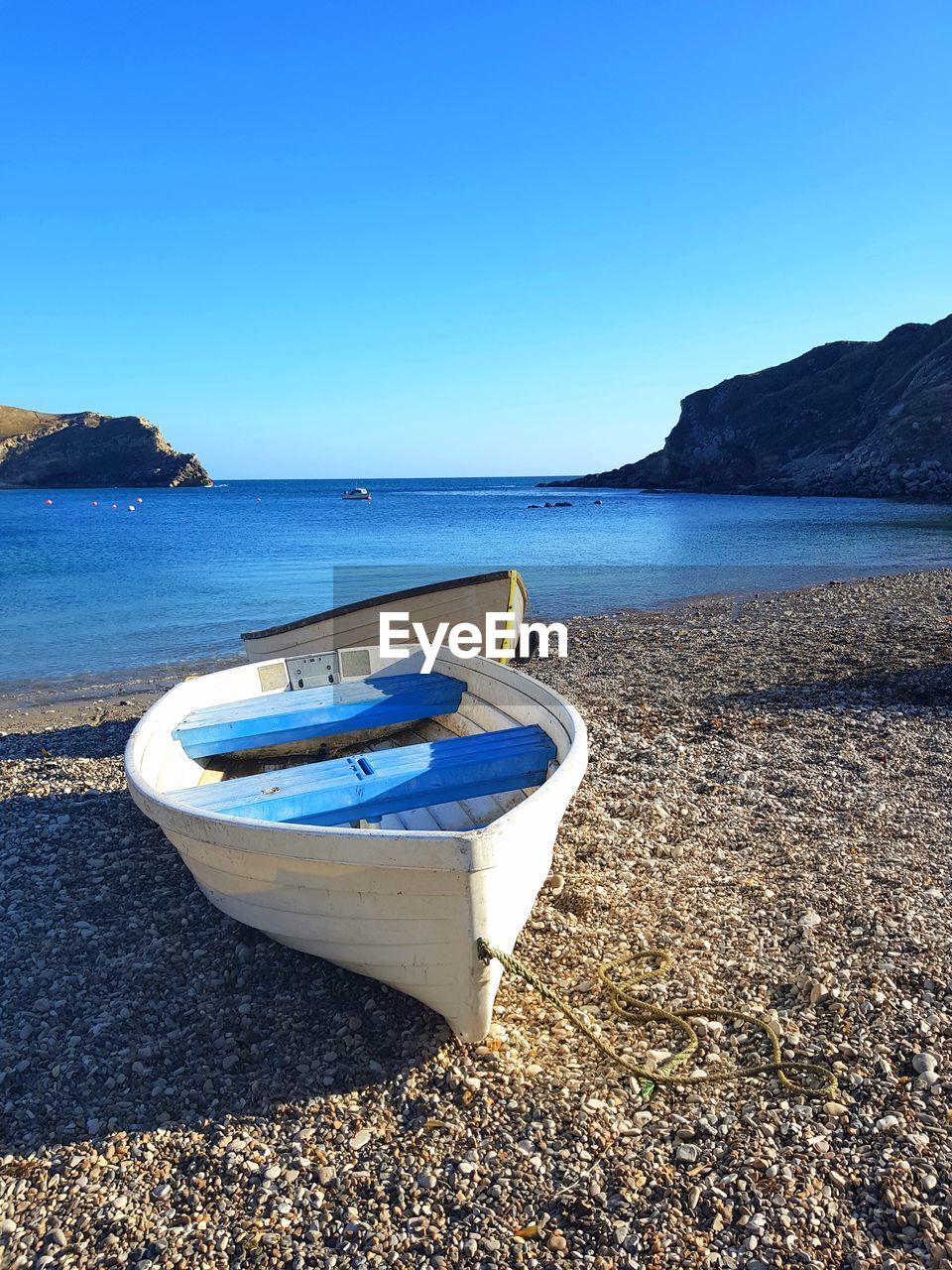 Scenic view of sea against clear blue sky