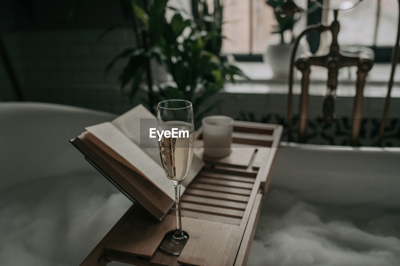 table, white, furniture, food and drink, no people, household equipment, indoors, drink, nature, room, chair, seat, drinking glass, glass, refreshment, plant, absence, cup, lighting, focus on foreground, still life, mug, tableware, domestic room, wood, day, publication