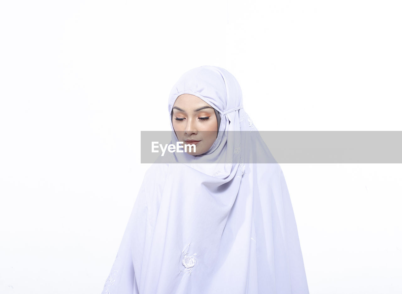 PORTRAIT OF BEAUTIFUL YOUNG WOMAN WEARING MASK