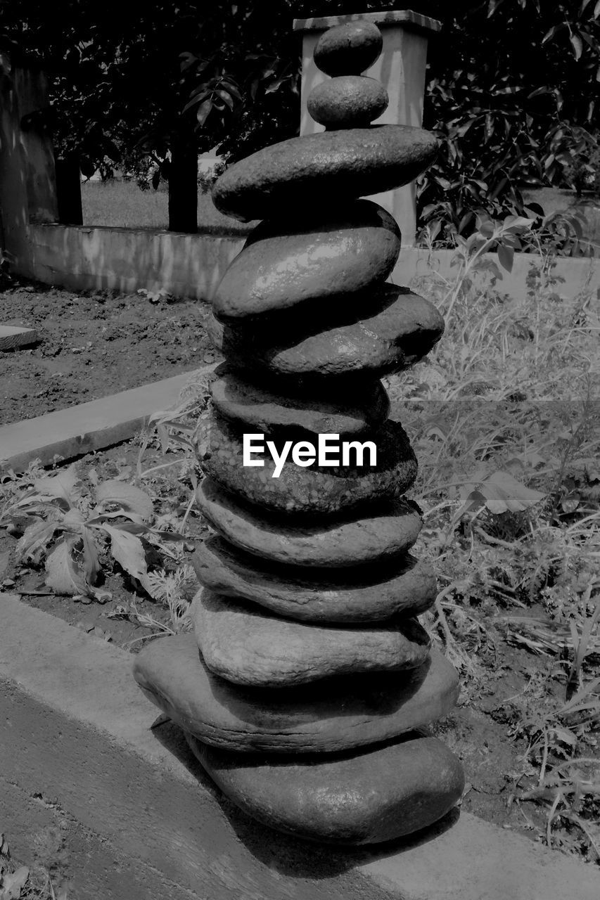 CLOSE-UP OF STONE STACK ON ROCKS