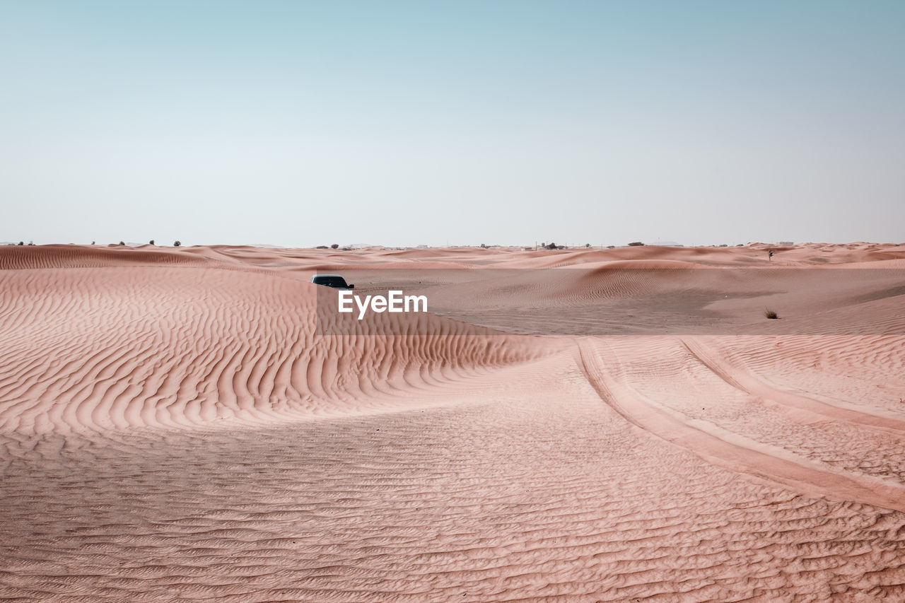 Scenic view of desert against clear sky