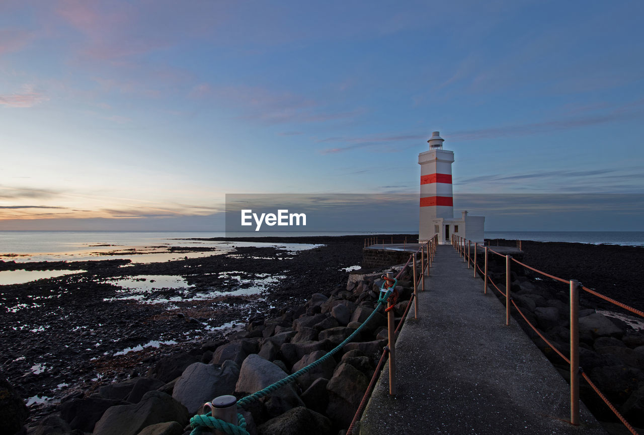 The gardskagi lighthouse is at the tip of gardur village in the reykjanes peninsula