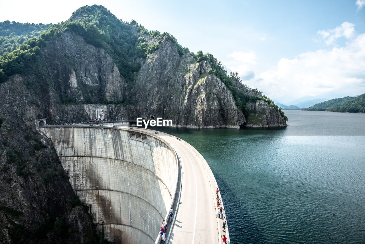 High angle view of dam with lake and ridge