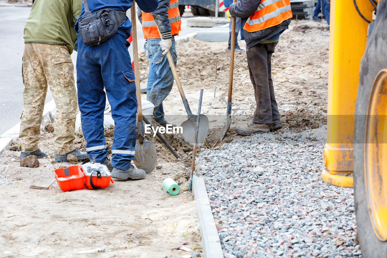 Low section of people working at construction site