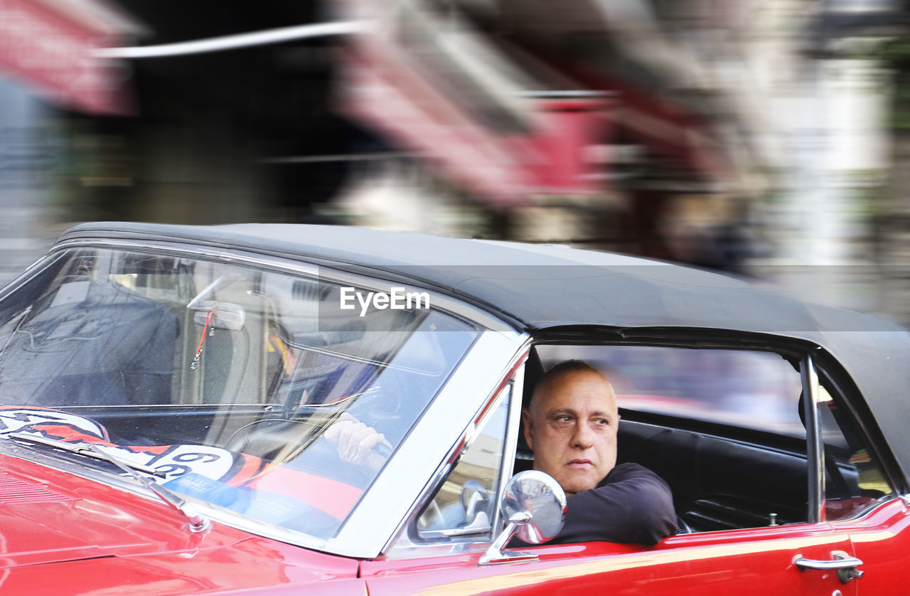 Man driving vintage car