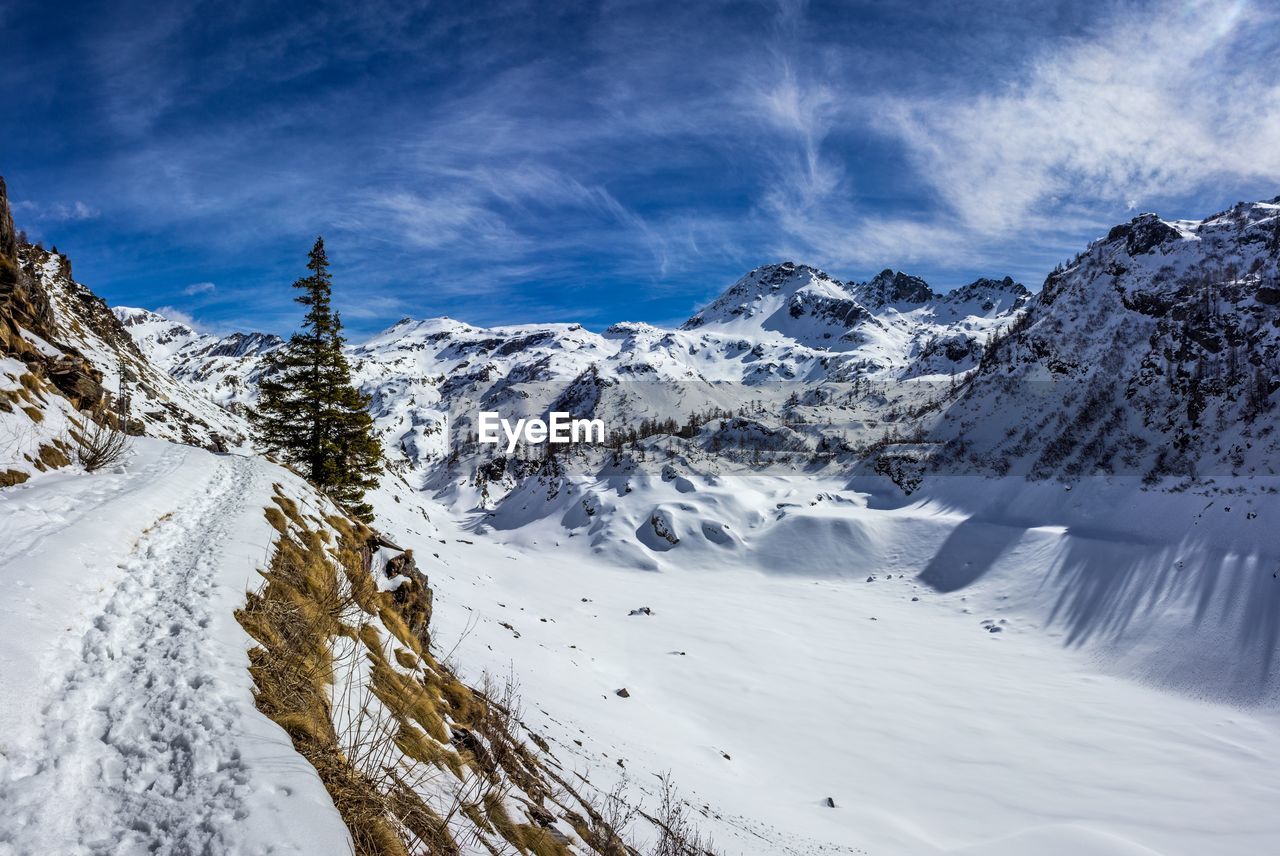 Scenic view of snowcapped mountains against sky