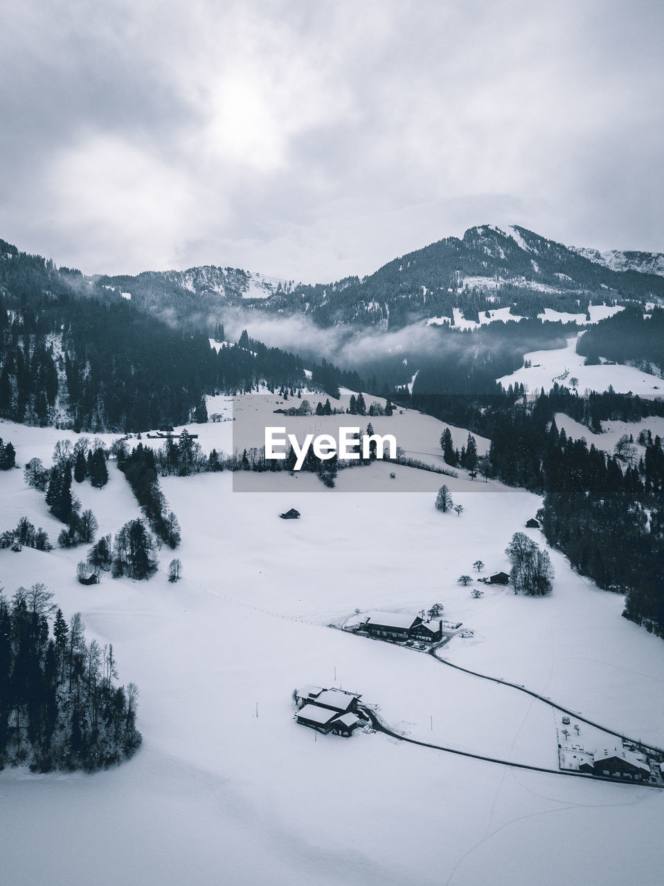 Scenic view of snow covered mountains against sky