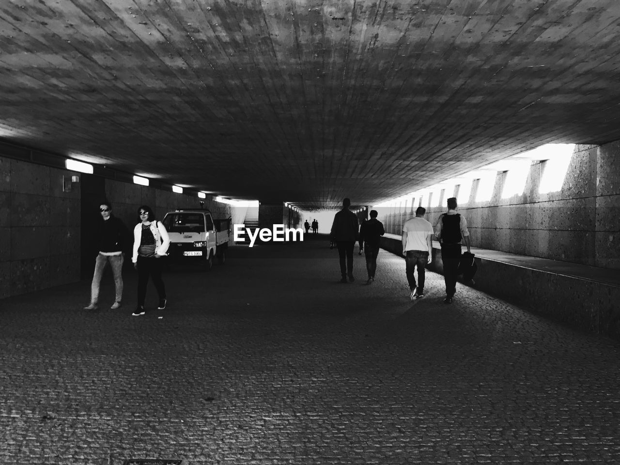 PEOPLE WALKING IN SUBWAY STATION