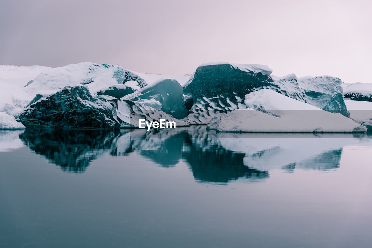 Scenic view of frozen lake against sky