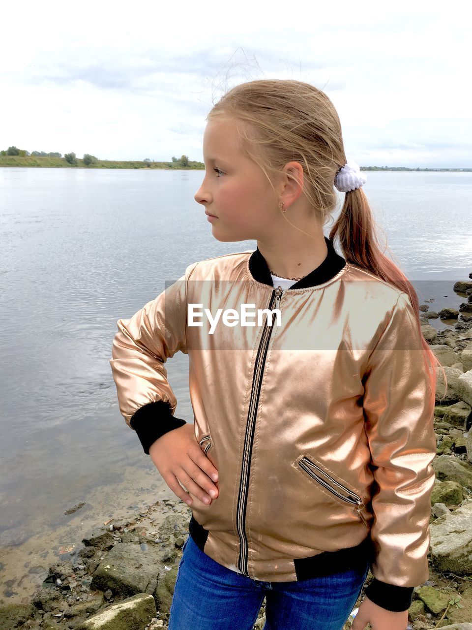 Full length of teenage girl standing in lake