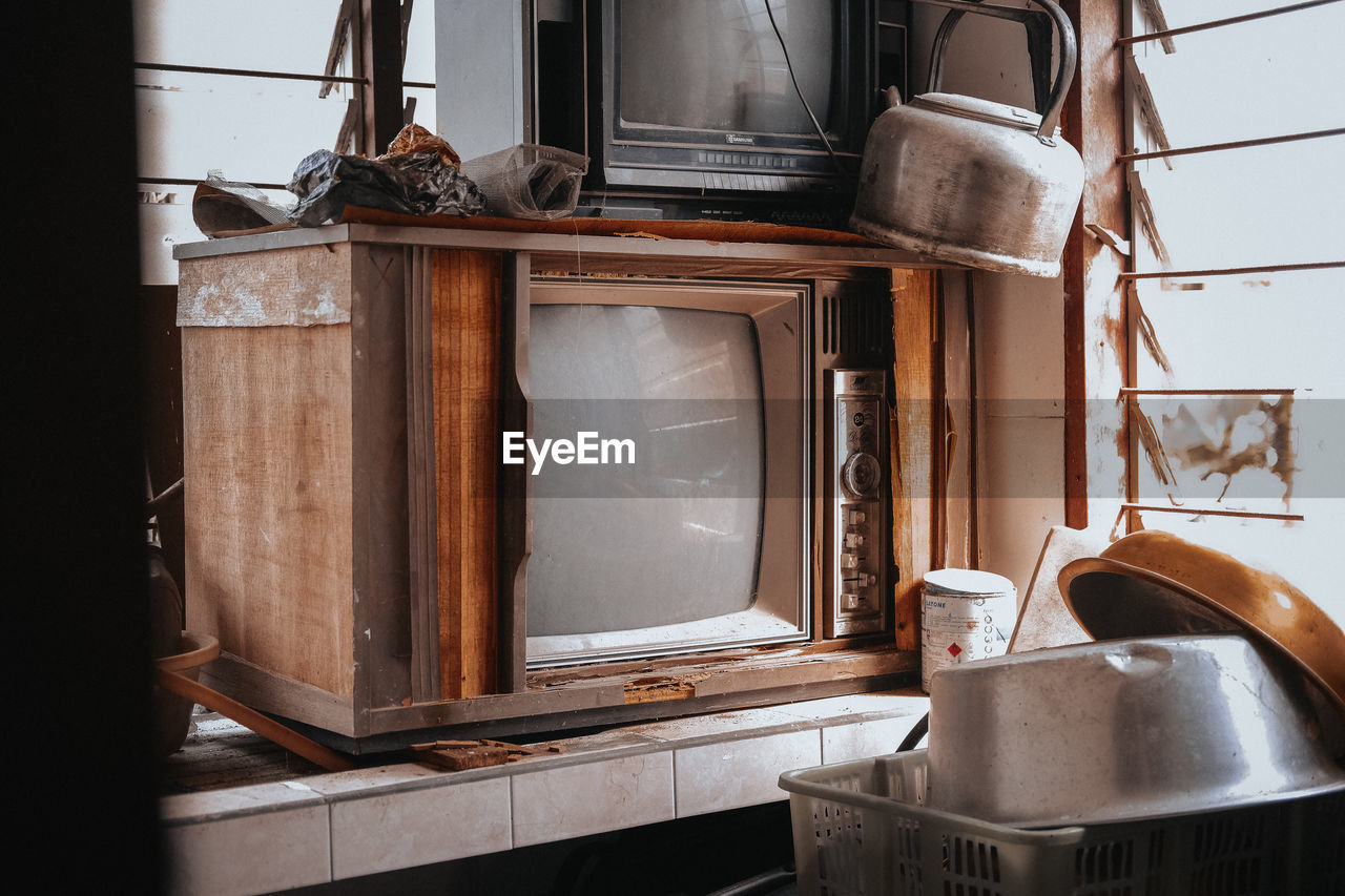 Old-fashioned television sets in room at home