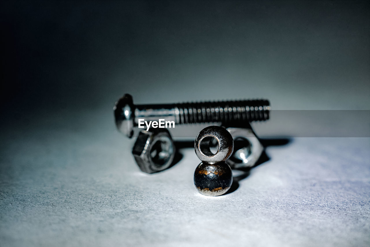 High angle view of nuts and bolt against white background