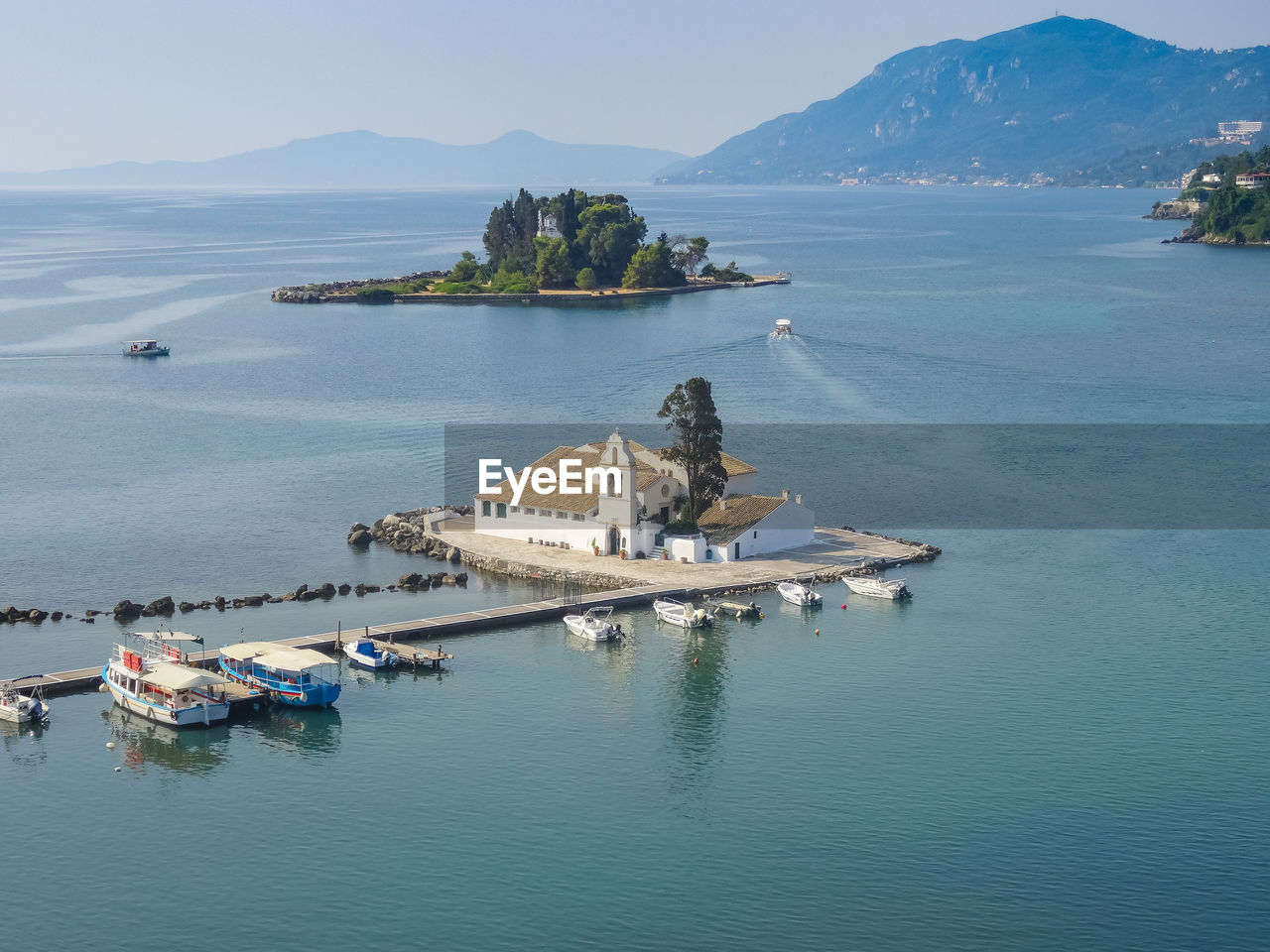 High angle view of boats moored at vlacherna monastery and pontikonisi