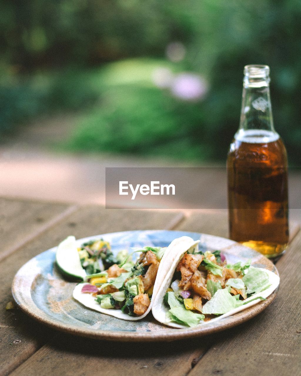 Close-up of food and beer served on table