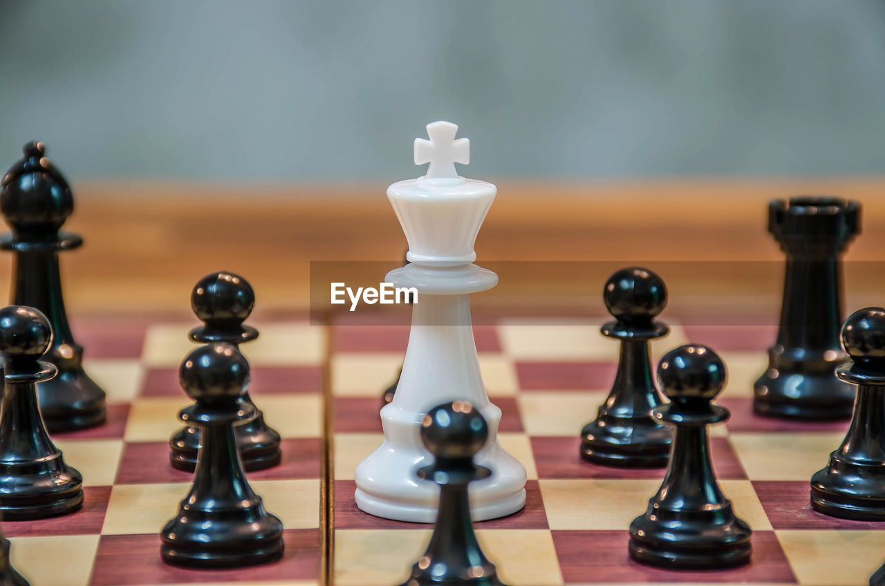 Close-up of chess pieces on table