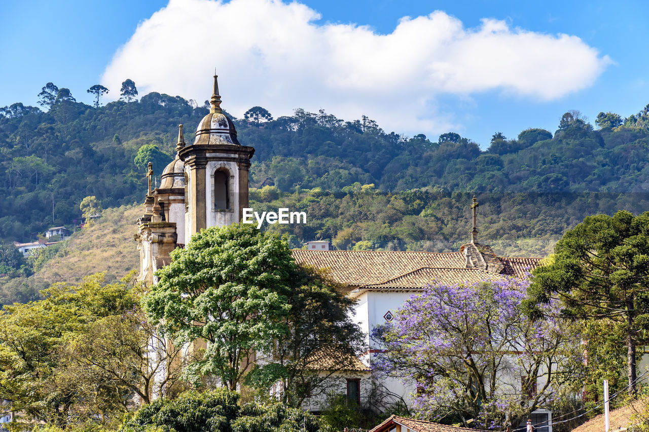 Historic colonial style church between vegetation at ouro preto  city