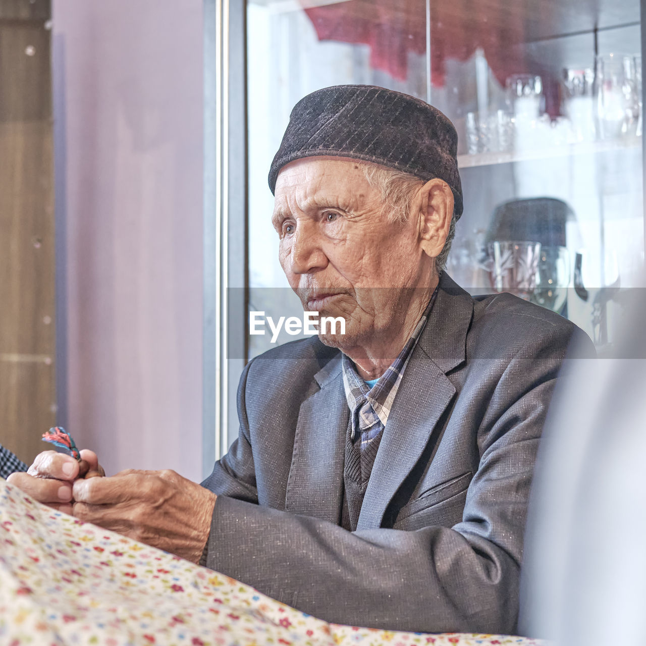 Portrait of man looking at window