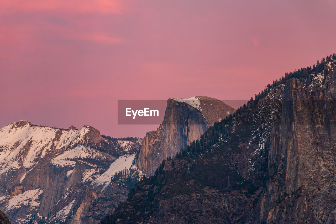 Panoramic view of half dome against sky during sunset.yosemite valley.