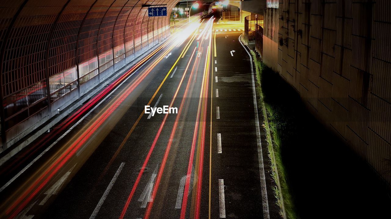 High angle view of light trails on road at night