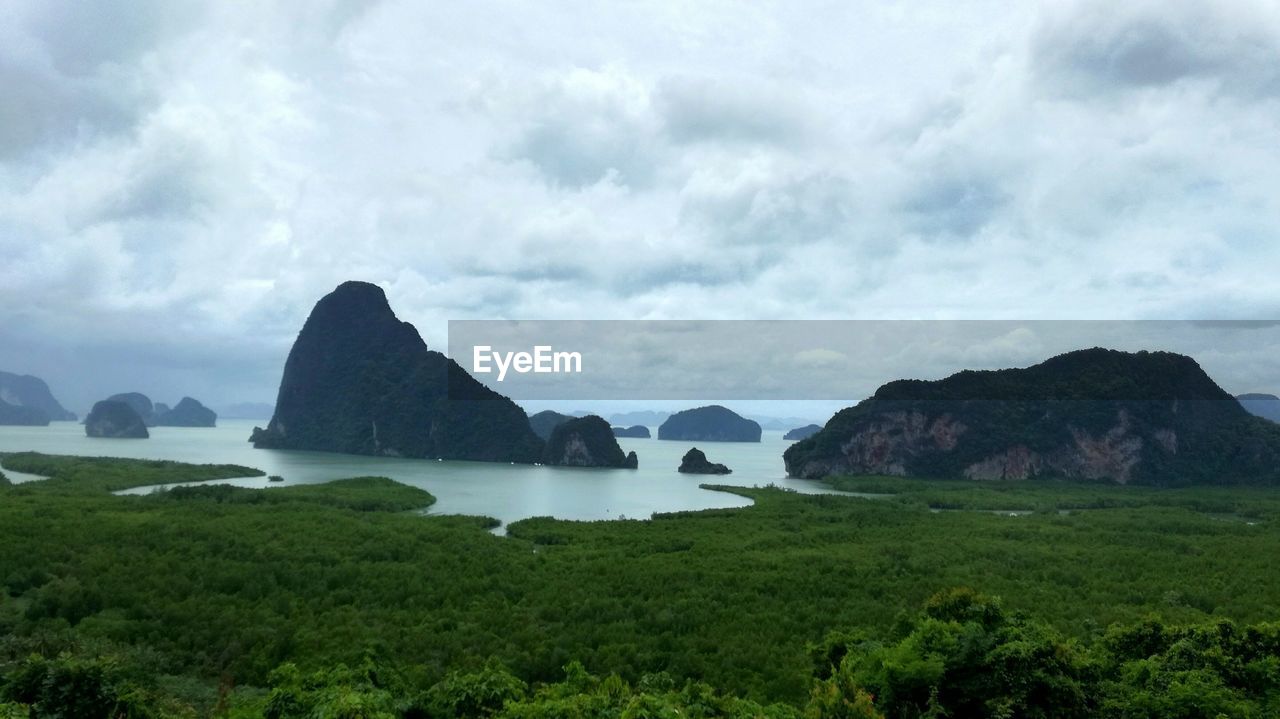 Panoramic shot of sea and rocks against sky