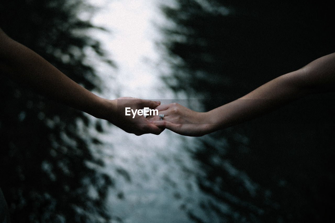 Low angle view of hands holding water