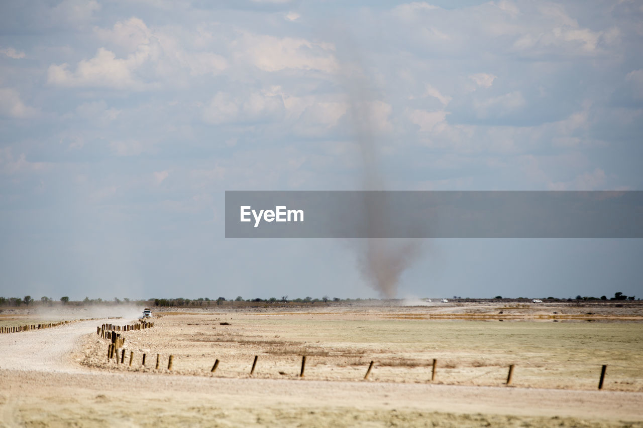 Dust devil by etosha pan, etosha national park, namibia