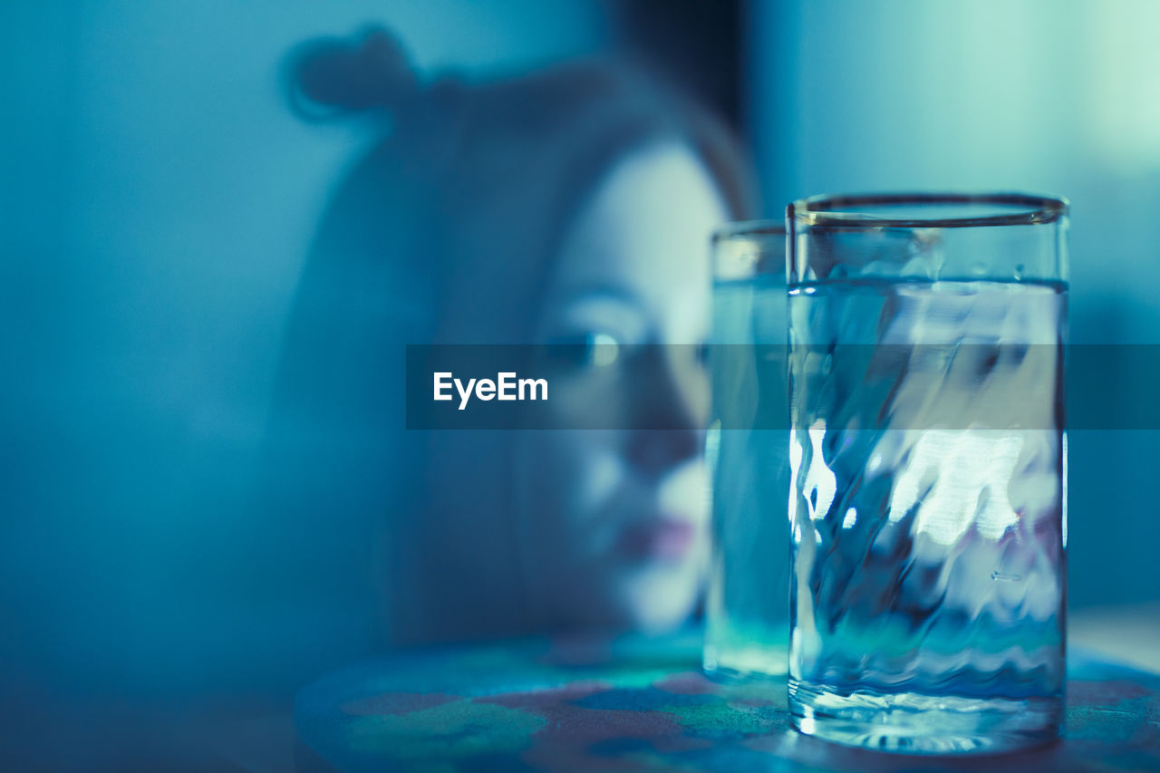 Close-up portrait of glass on table