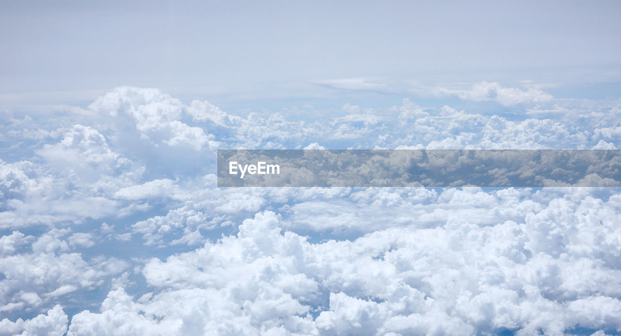 AERIAL VIEW OF CLOUDSCAPE AGAINST BLUE SKY