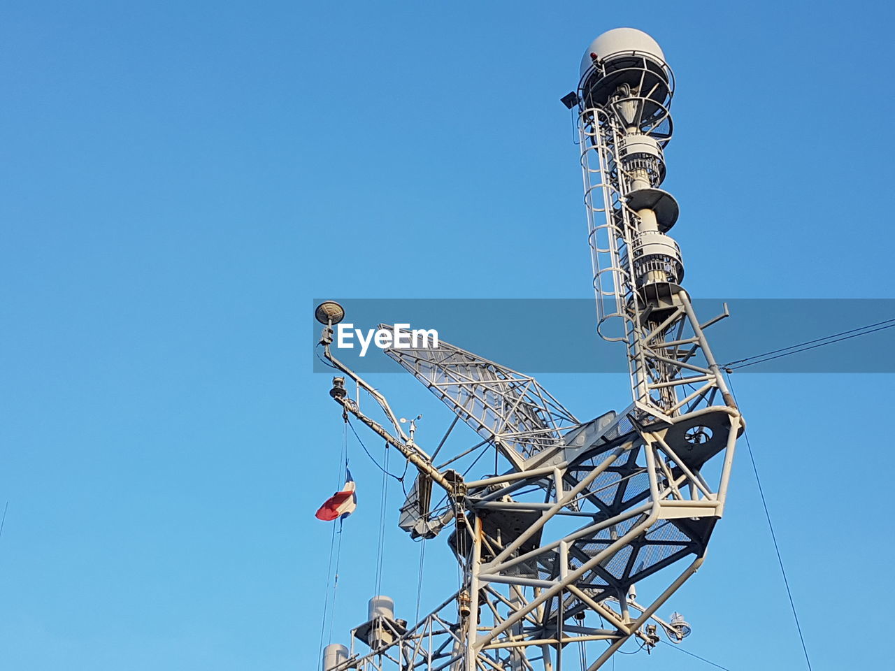 LOW ANGLE VIEW OF ROLLERCOASTER AGAINST CLEAR SKY