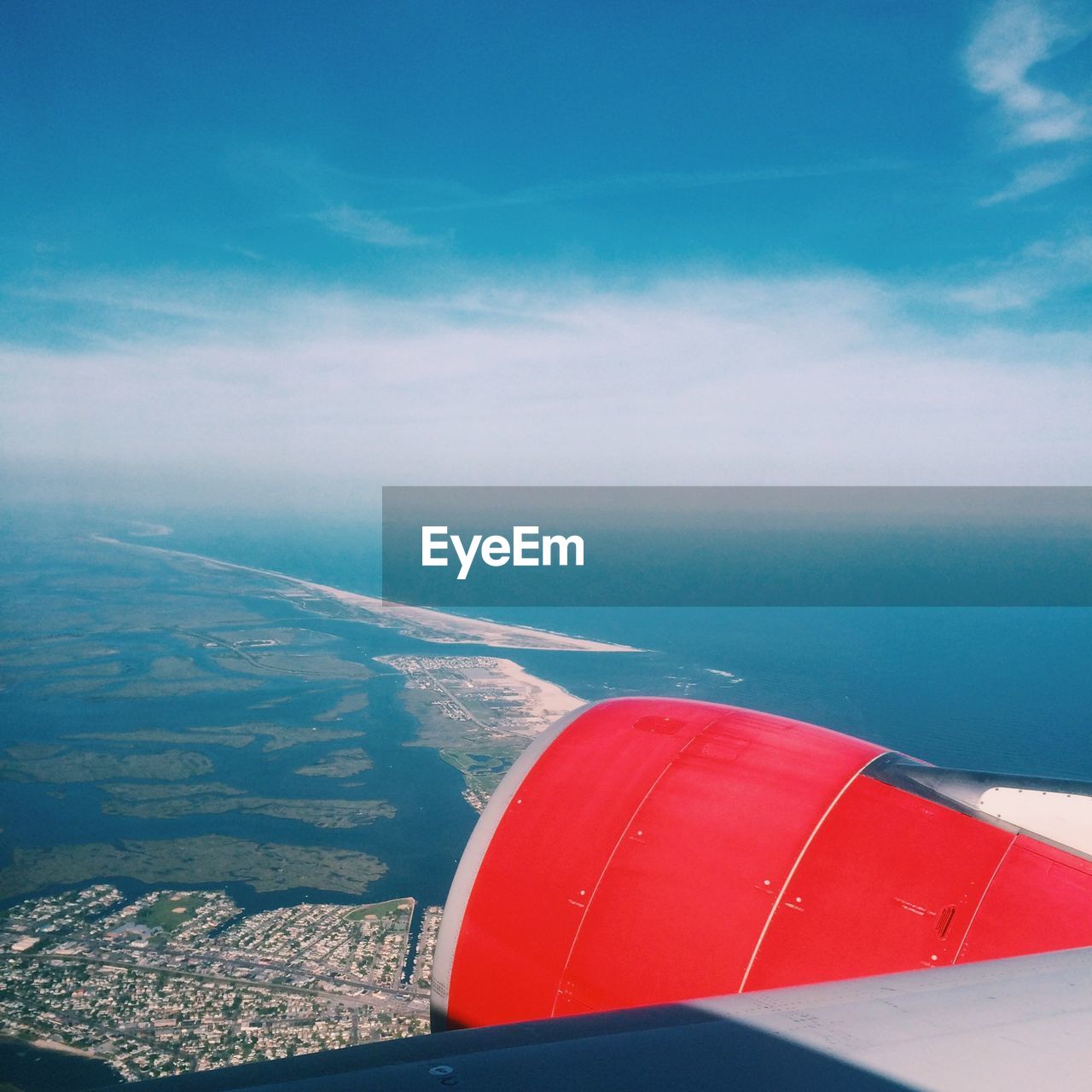 Landscape against sea seen from airplane