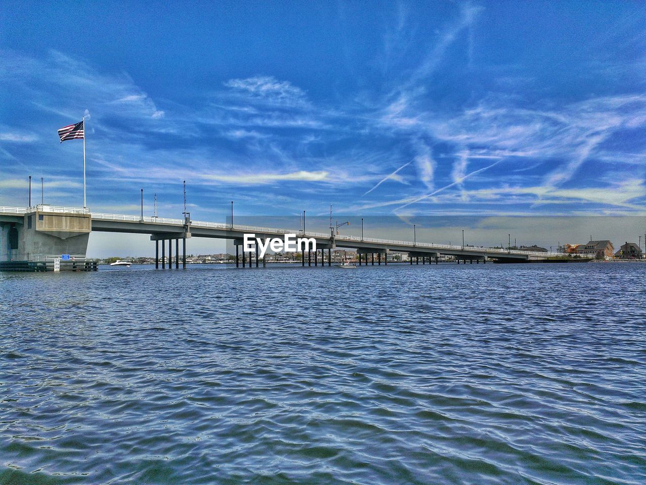 Distance shot of bridge over blue sea