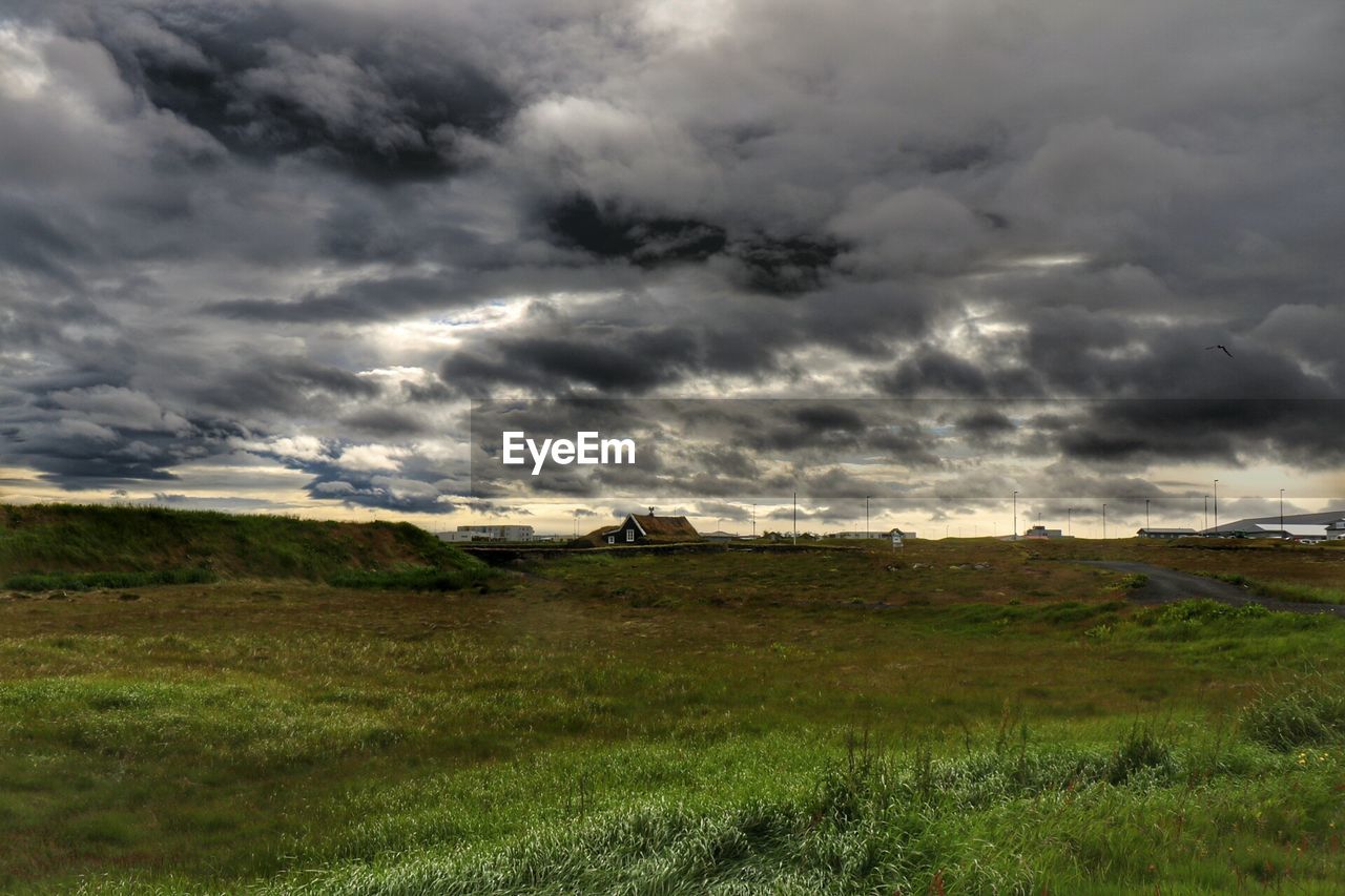 SCENIC VIEW OF LANDSCAPE AGAINST CLOUDY SKY