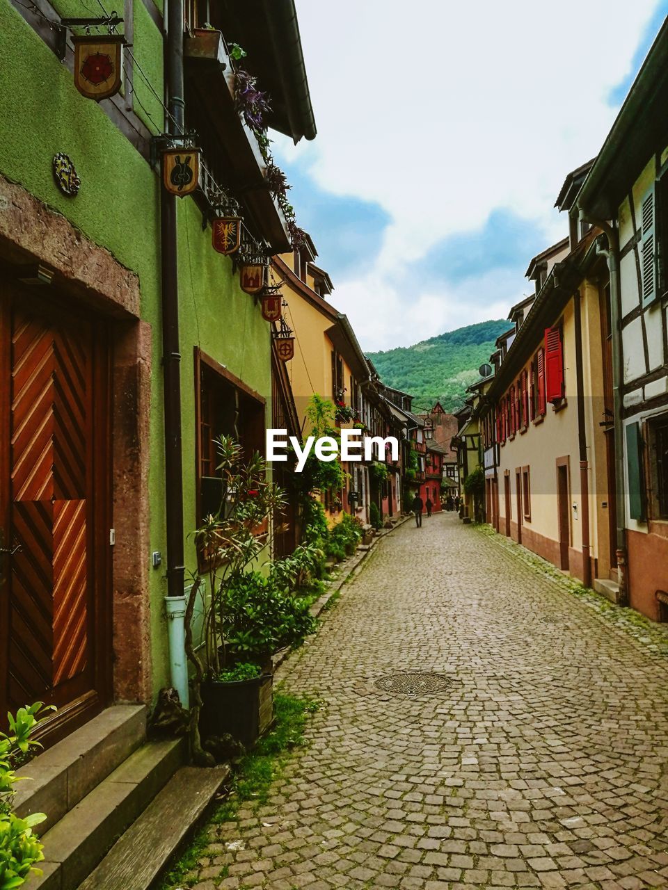 Empty alley amidst buildings in city